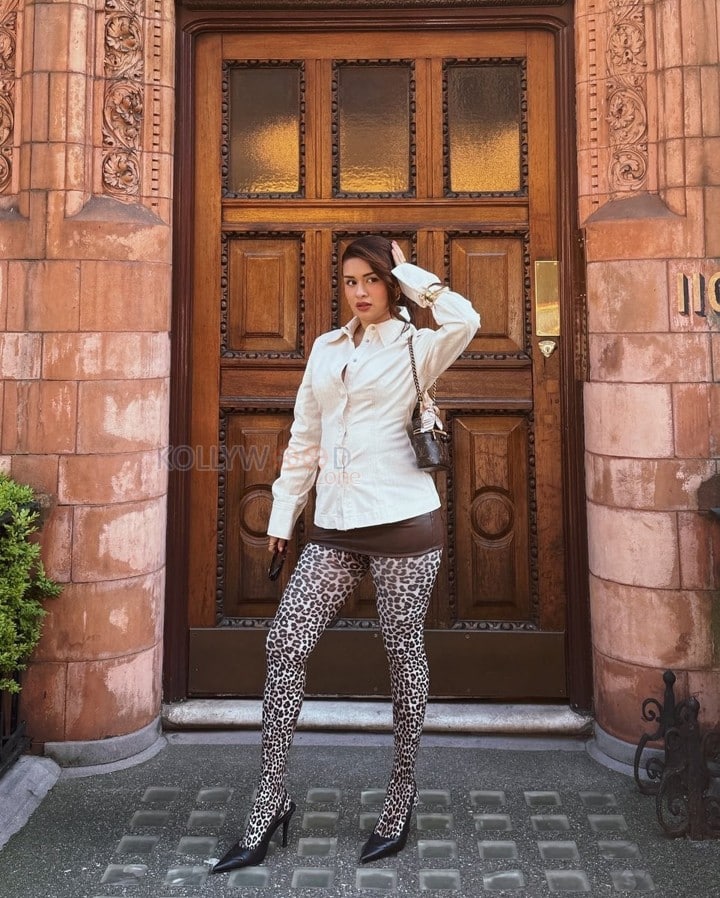 Chic Beauty Avneet Kaur in a White Shirt with Brown Mini Skirt and Printed Long Socks Photos 04