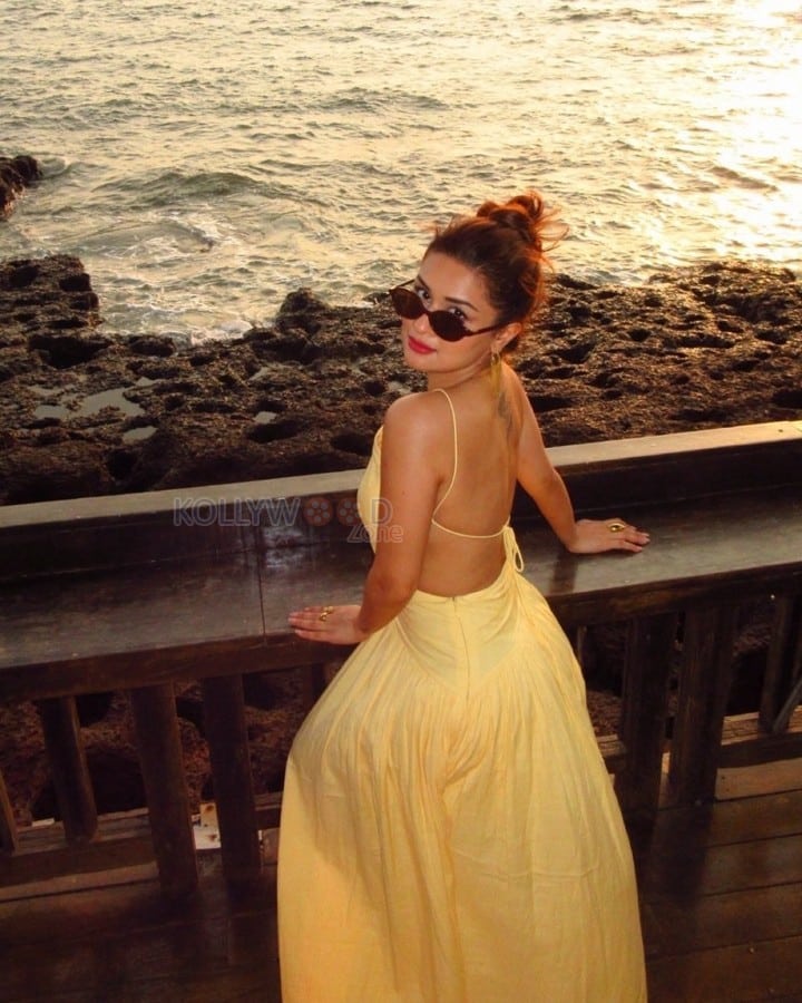 Gorgeous Avneet Kaur in a Yellow Backless Maxi Dress Photos 01