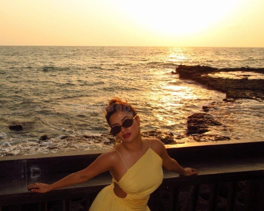 Gorgeous Avneet Kaur in a Yellow Backless Maxi Dress Photos 02