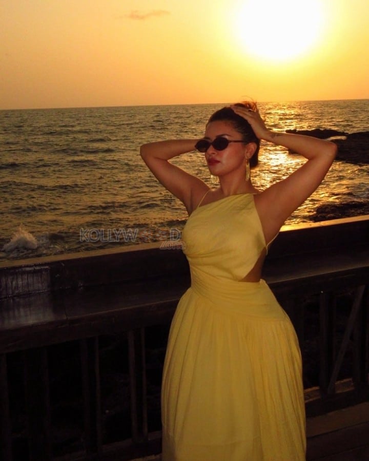Gorgeous Avneet Kaur in a Yellow Backless Maxi Dress Photos 03