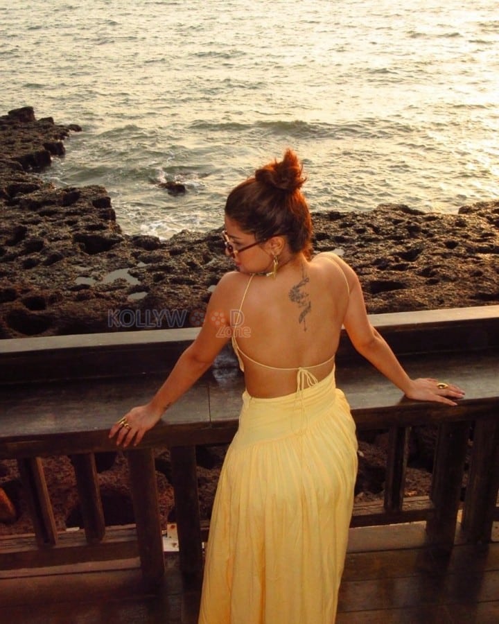Gorgeous Avneet Kaur in a Yellow Backless Maxi Dress Photos 04