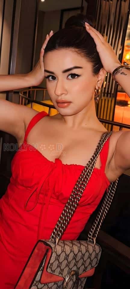 Sexy Avneet Kaur in a Red Sleeveless Split Long Dress Photos 02