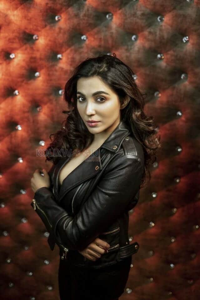 Actress Parvati Nair in a Stylish Leather Jacket Photos 01