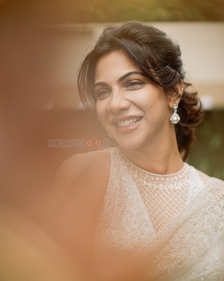 Adhirshtasaali Actress Madonna Sebastian in a White Sheer Bridal Saree Photos 06