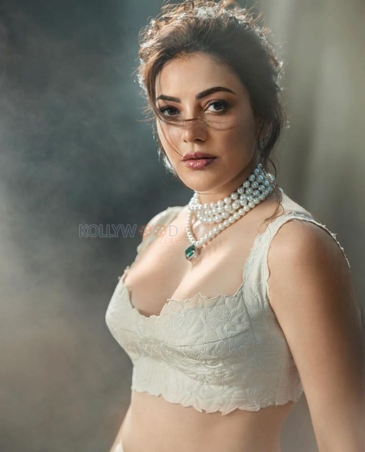 Beautiful Kajal Aggarwal in a White Embroidered Lehenga Photos 01