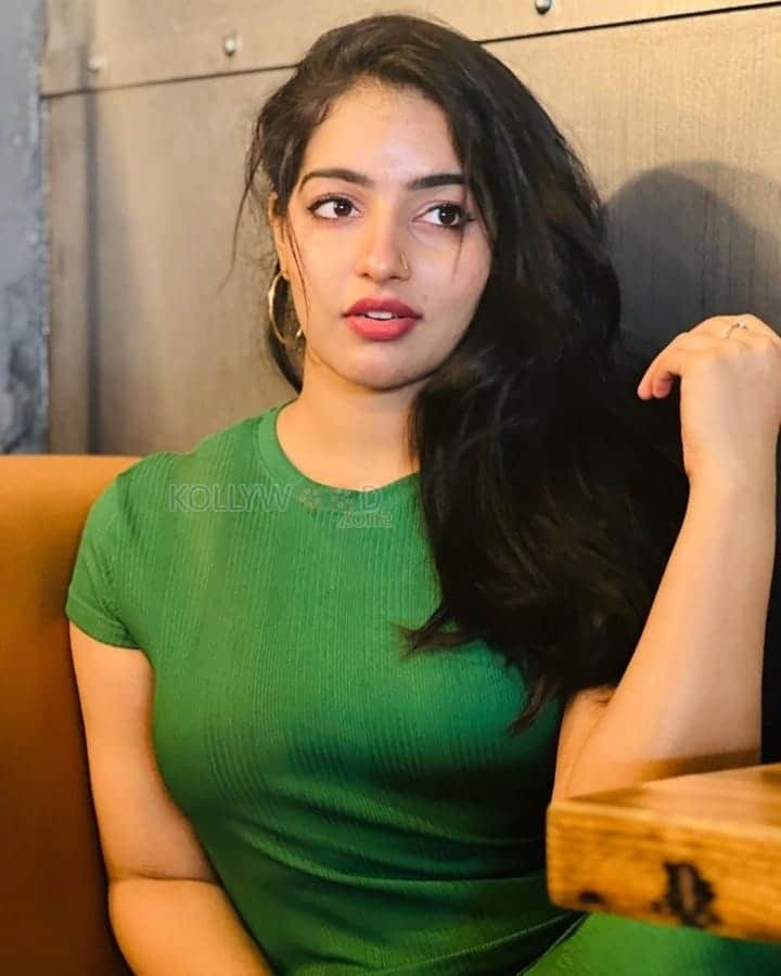 Beautiful Malavika Menon in a Green Top Photos 01