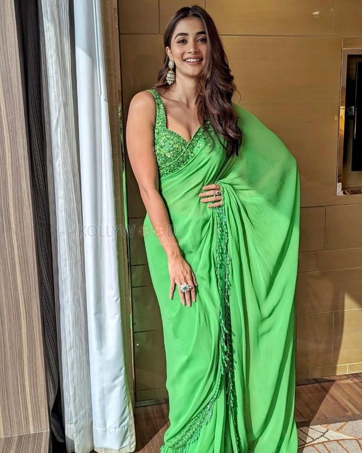 Beautiful Pooja Hegde in a Green Embroidered Saree with Sleeveless Blouse Photos 02