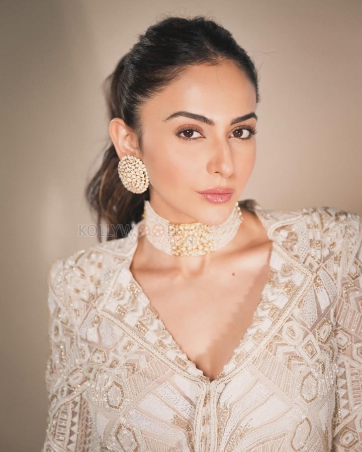 Beautiful Rakul Preet Singh in a White and Gold Sharara set Photos 02