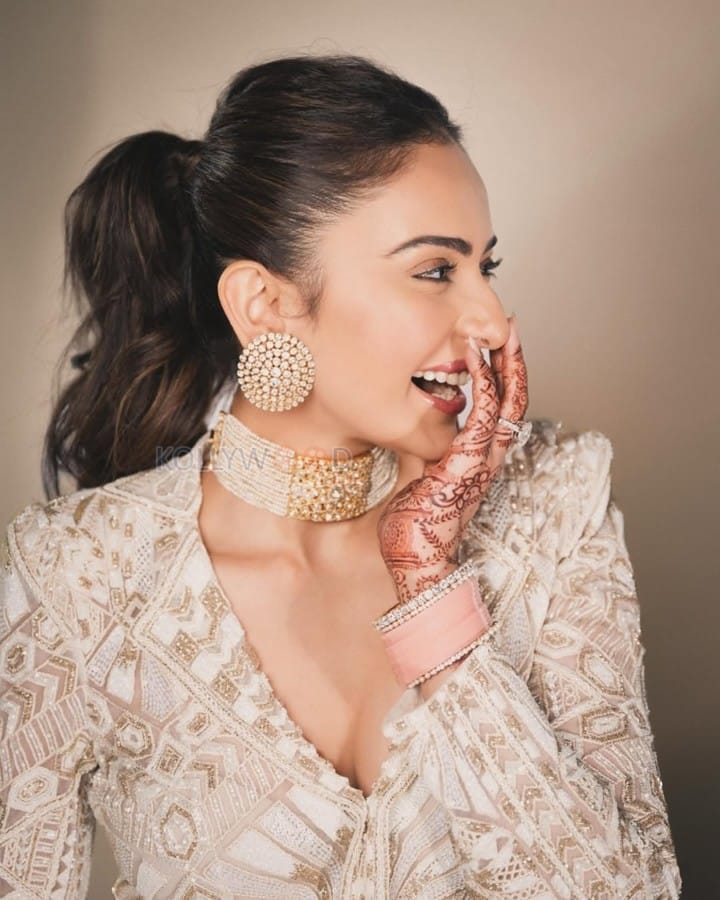 Beautiful Rakul Preet Singh in a White and Gold Sharara set Photos 04