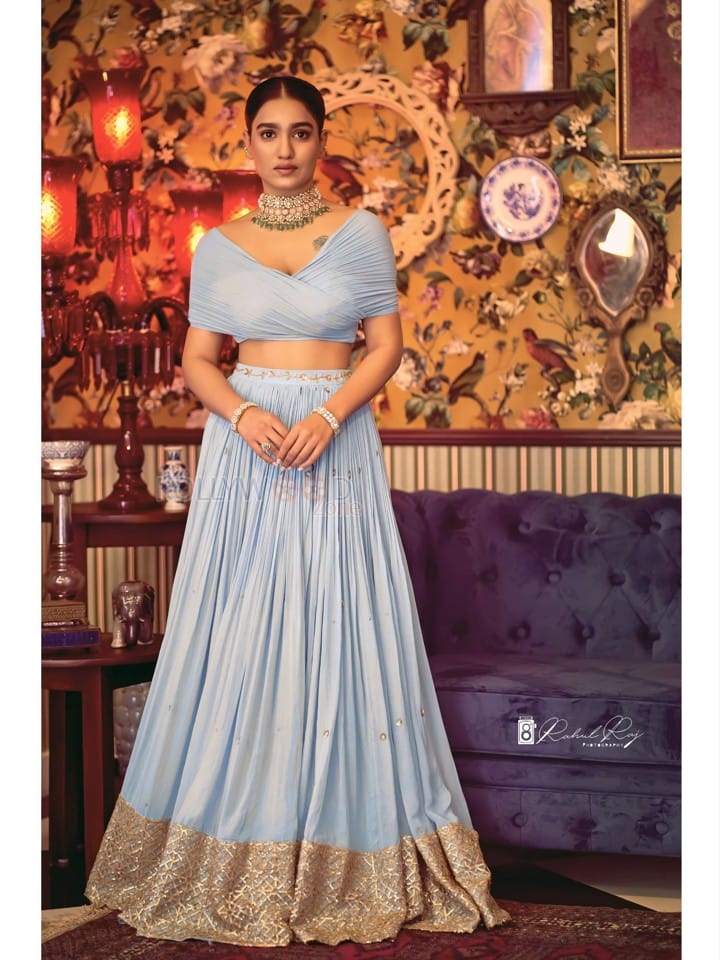 Beautiful Saniya Iyyappan in a Blue Lehenga Dress Photos 01