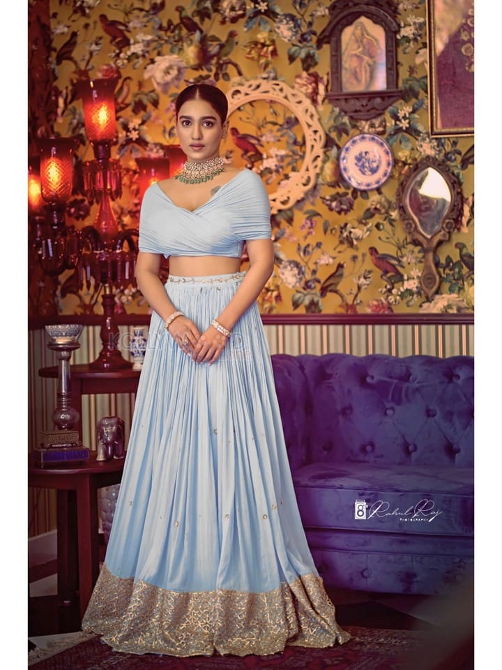 Beautiful Saniya Iyyappan in a Blue Lehenga Dress Photos 04