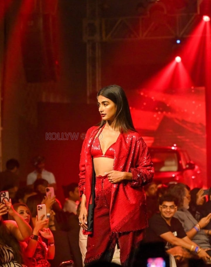 Bold Pooja Hegde in a Red Sequinned Bralette with an Oversized Blazer and Shimmery Pant at Mahindra Tech Fashion Tour Pictures 06