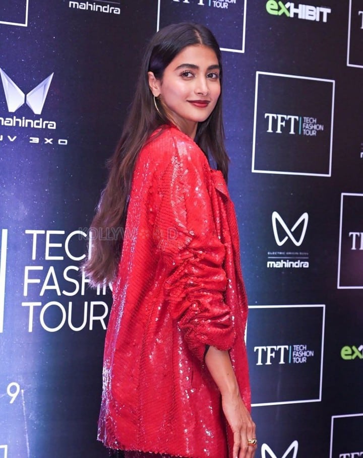 Bold Pooja Hegde in a Red Sequinned Bralette with an Oversized Blazer and Shimmery Pant at Mahindra Tech Fashion Tour Pictures 07