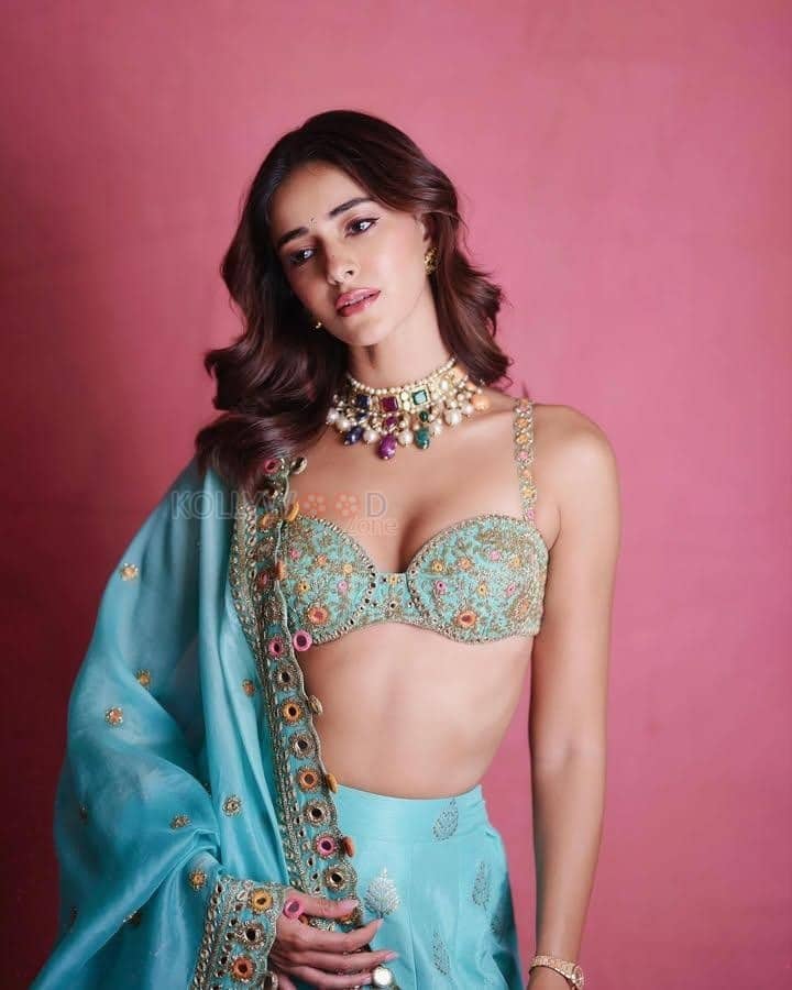 Bollywood Actress Ananya Panday in a Golden and Light Turquoise Lehenga with a Bralette Blouse Photos 02