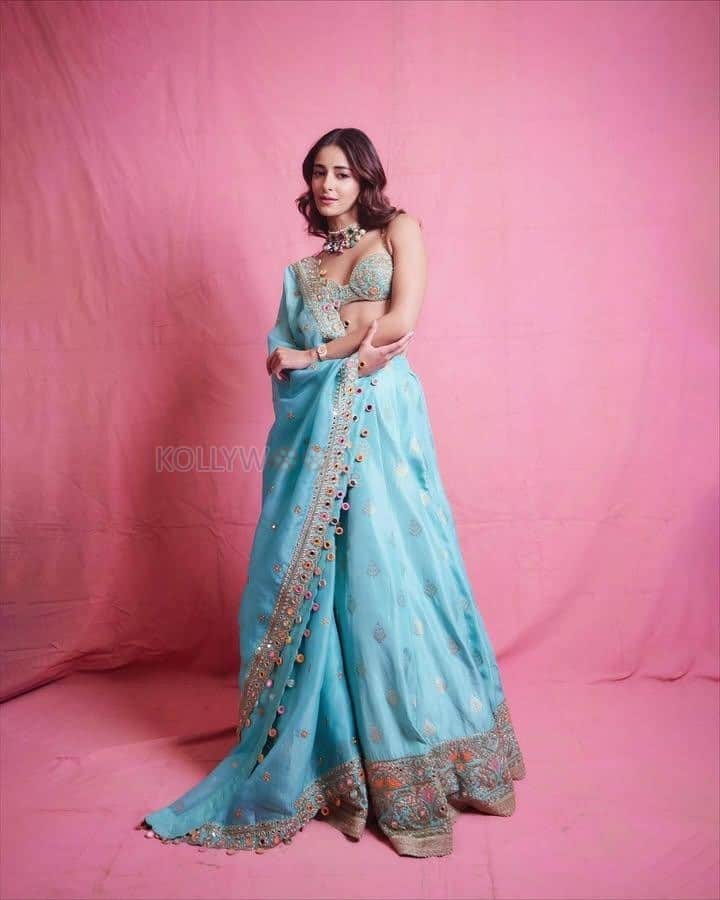 Bollywood Actress Ananya Panday in a Golden and Light Turquoise Lehenga with a Bralette Blouse Photos 03