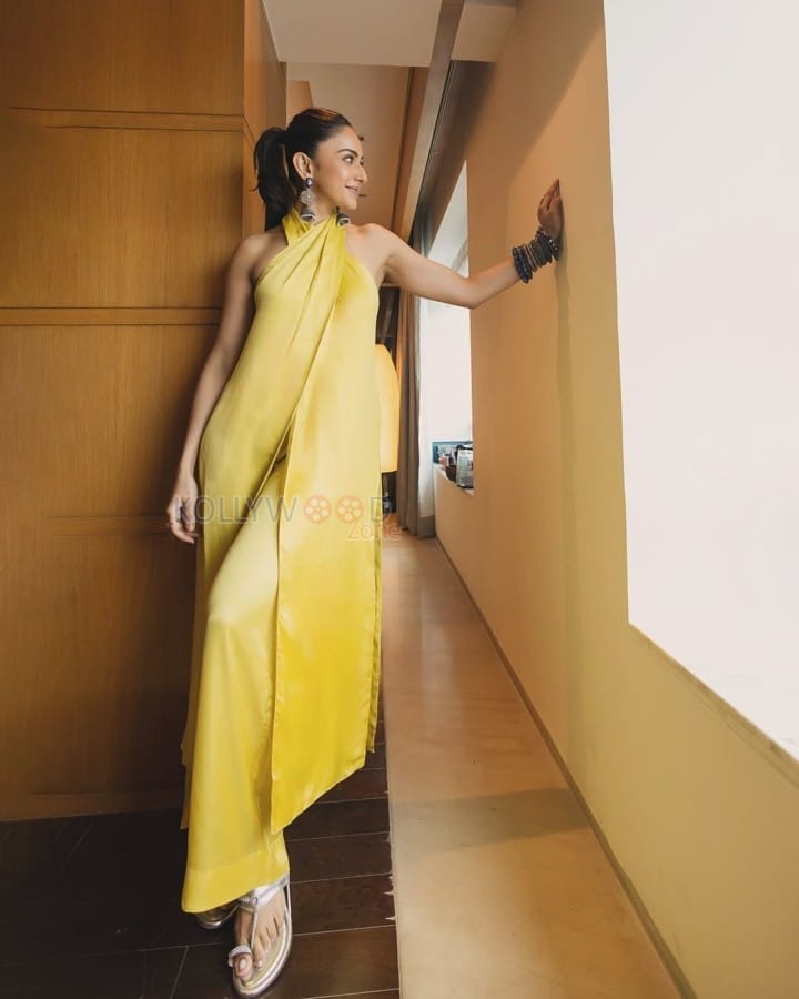 Bollywood Diva Rakul Preet Singh in a Yellow Backless Top and Wide Legged Pants Photos 01