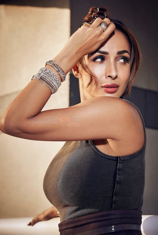 Bollywood Hottie Malaika Arora in a Black Sleeveless Ribbed Bodysuit with a Faux Leather Skirt Photos 01