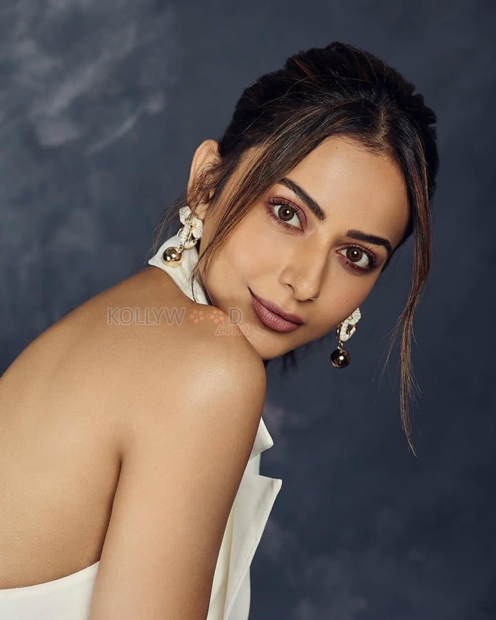 Breathtaking Rakul Preet Singh in a White Halter Neck Blazer Skirt Pictures 01