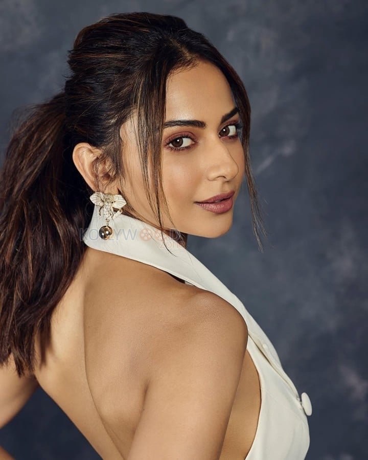 Breathtaking Rakul Preet Singh in a White Halter Neck Blazer Skirt Pictures 03