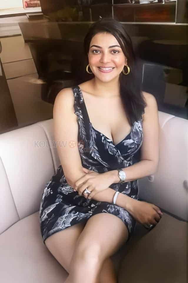 Busty Kajal Aggarwal in a Black White Floral Mini Dress Photo 01