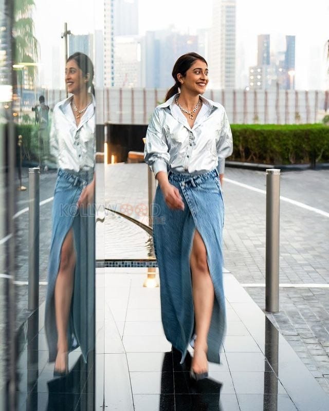 Charming Regina Cassandra in a Silver Shirt and Blue Midi Photos 02