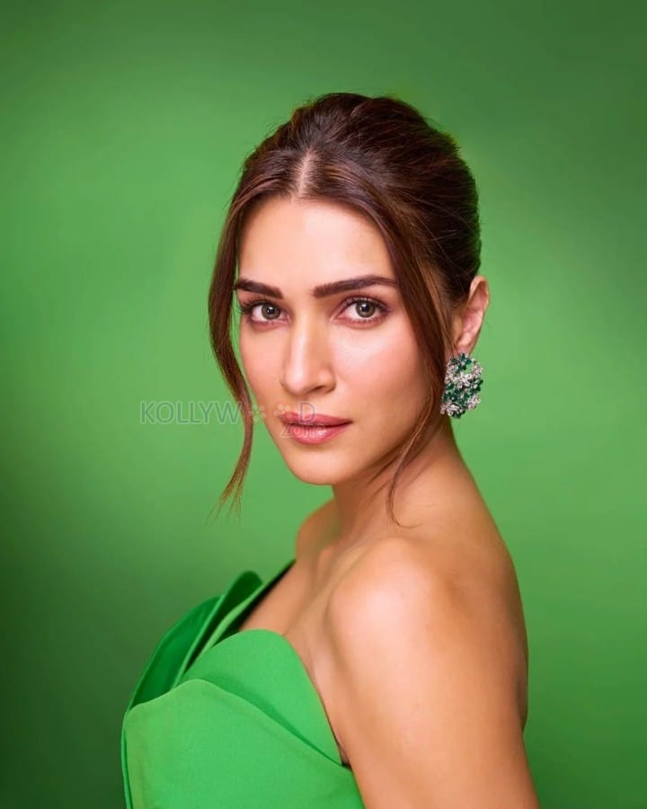 Classy Kriti Sanon in a Fouad Sarkis Green Satin Strapless Bodycon Gown Embelished with Drapes Photos 03