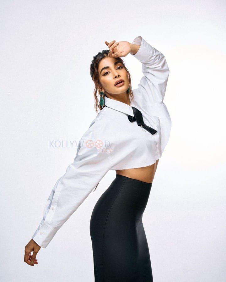 Classy Pooja Hegde in a White Full Sleeve Crop Shirt and Black Pant Photos 04