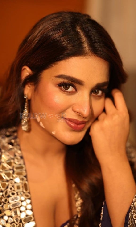 Cute Nidhhi Agerwal in a Mirror Covered Two Piece Dress with a Matching Jacket Photos 03