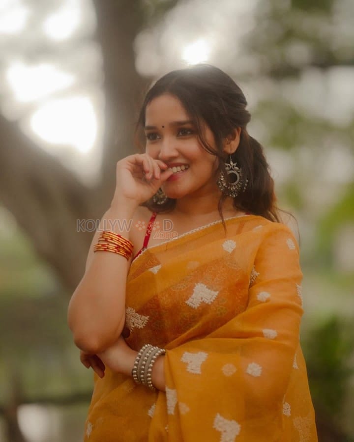 Dazzling Anikha Surendran in a Yellow Saree Pictures 05