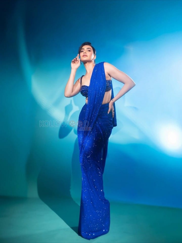 Dazzling Karishma Tanna in a Royal Blue Sequin Shimmery Saree with a Sleeveless Blouse Photos 01