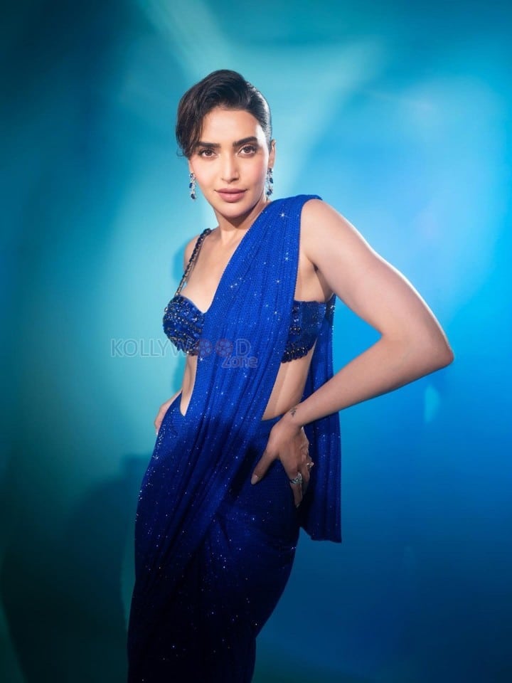 Dazzling Karishma Tanna in a Royal Blue Sequin Shimmery Saree with a Sleeveless Blouse Photos 03