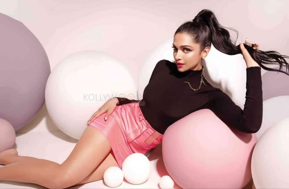Deepika Padukone in a Black Top and Pink Leather Skirt Leaning on Balloons Photo 01
