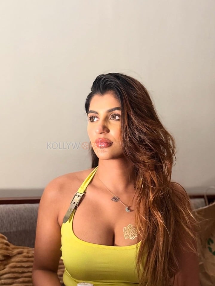Devils Double Next Level Actress Yashika Aannand in a Lime Green Halter Neck Top Pictures 01