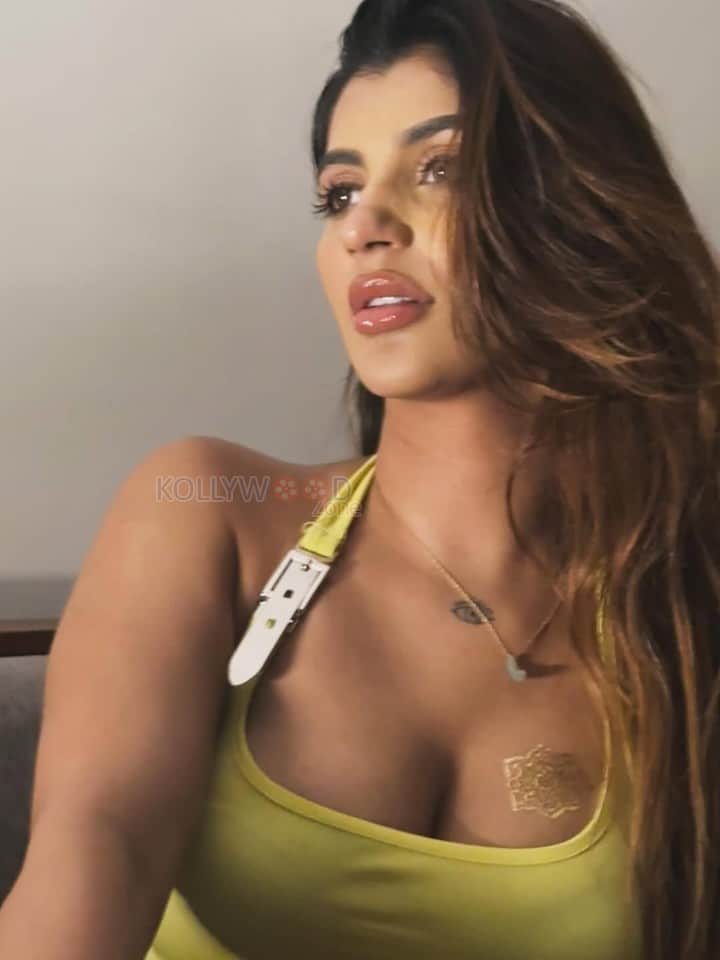 Devils Double Next Level Actress Yashika Aannand in a Lime Green Halter Neck Top Pictures 02