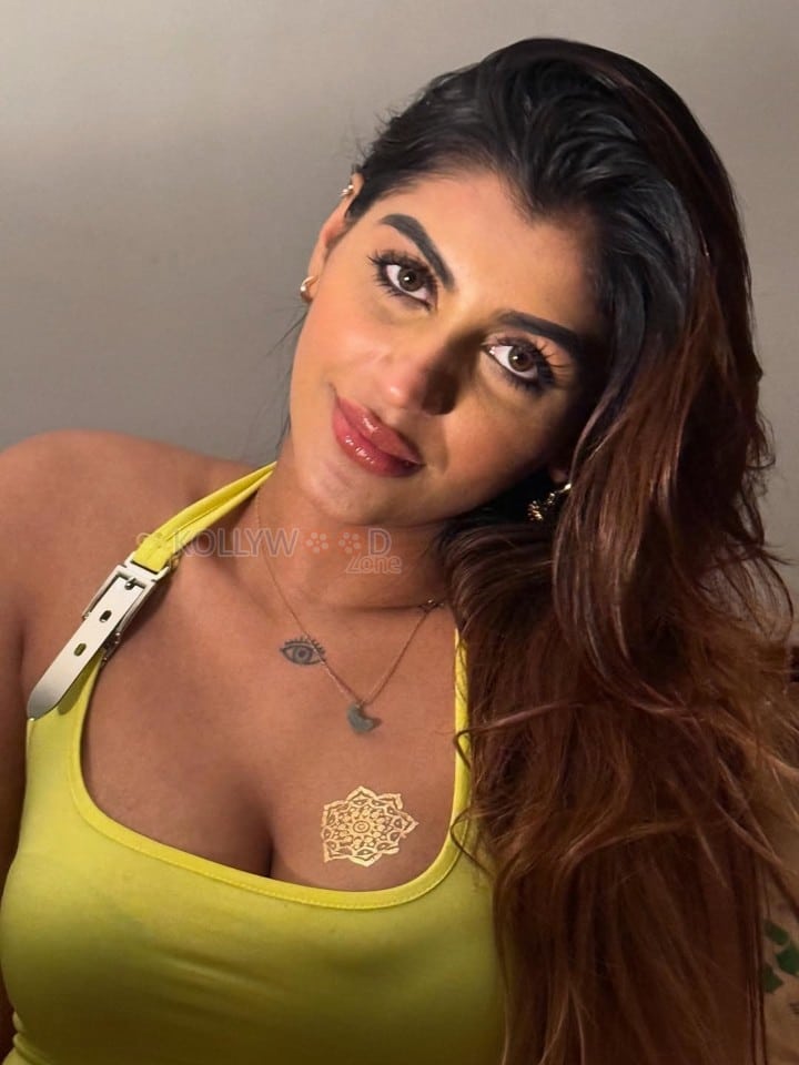 Devils Double Next Level Actress Yashika Aannand in a Lime Green Halter Neck Top Pictures 03