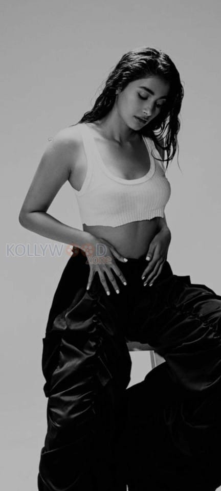 Dusky Babe Pooja Hegde in a White Crop Tank Top and Blue Pant Photos 01