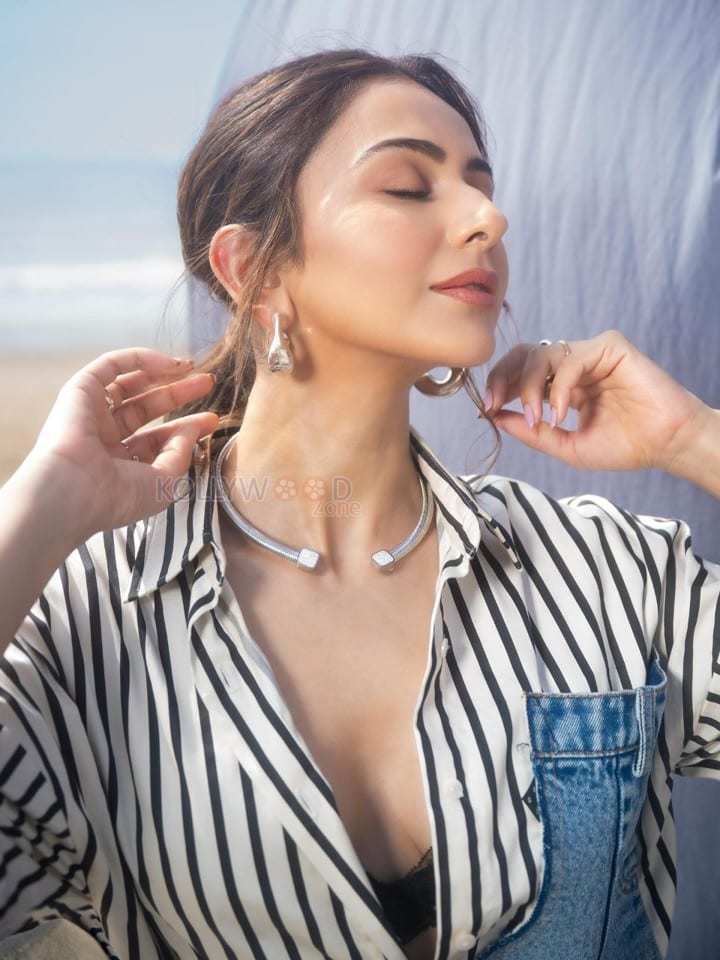 Fashionable Rakul Preet Singh in a Black and White Striped Denim Shirt with a Black Bralette and Fitted Pencil Skirt Pictures 01