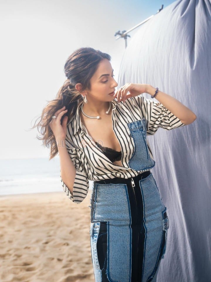 Fashionable Rakul Preet Singh in a Black and White Striped Denim Shirt with a Black Bralette and Fitted Pencil Skirt Pictures 03