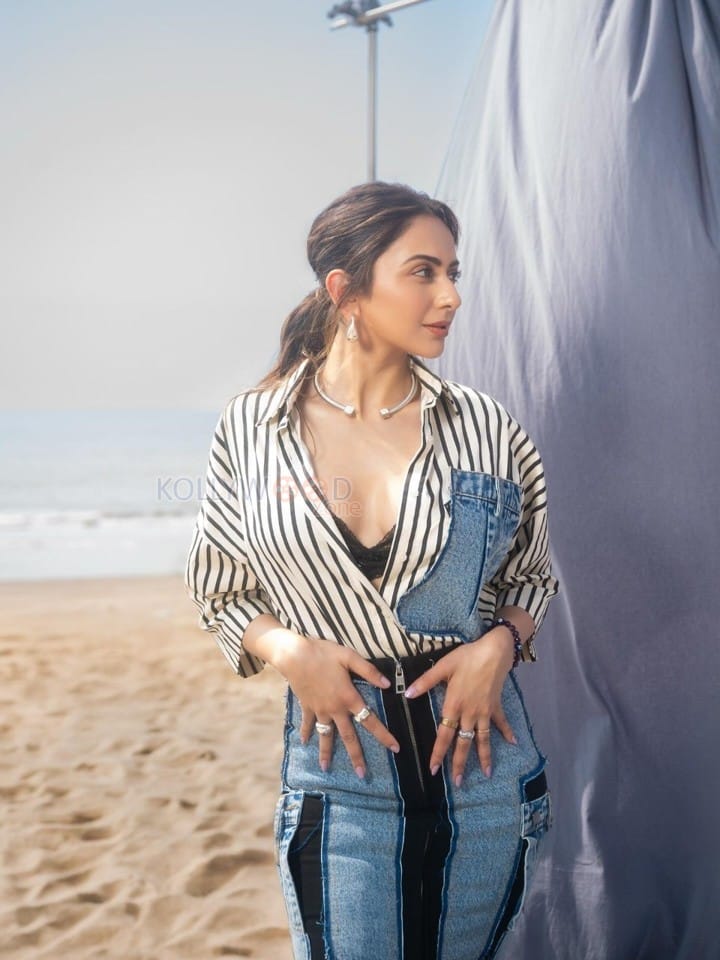Fashionable Rakul Preet Singh in a Black and White Striped Denim Shirt with a Black Bralette and Fitted Pencil Skirt Pictures 04