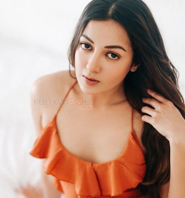 Glamorous Catherine Tresa in an Orange High Slit Bodycon Dress showcasing her Toned Thighs Photos 02