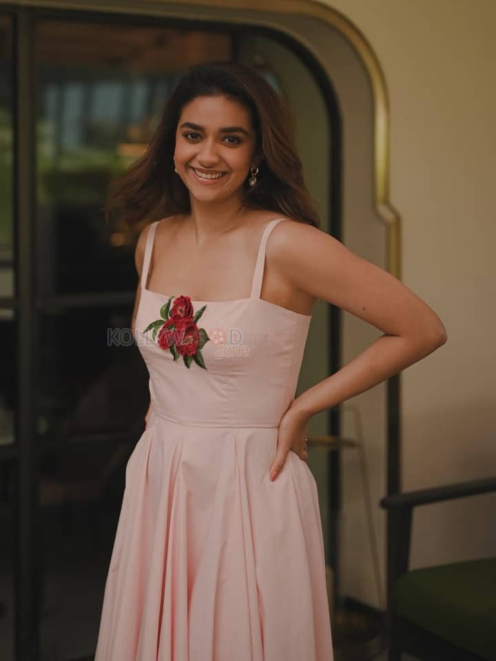 Glamorous Keerthy Suresh in a Light Pink Strappy Gown with a Red Rose Photos 03