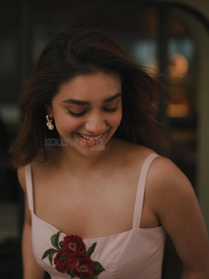 Glamorous Keerthy Suresh in a Light Pink Strappy Gown with a Red Rose Photos 04