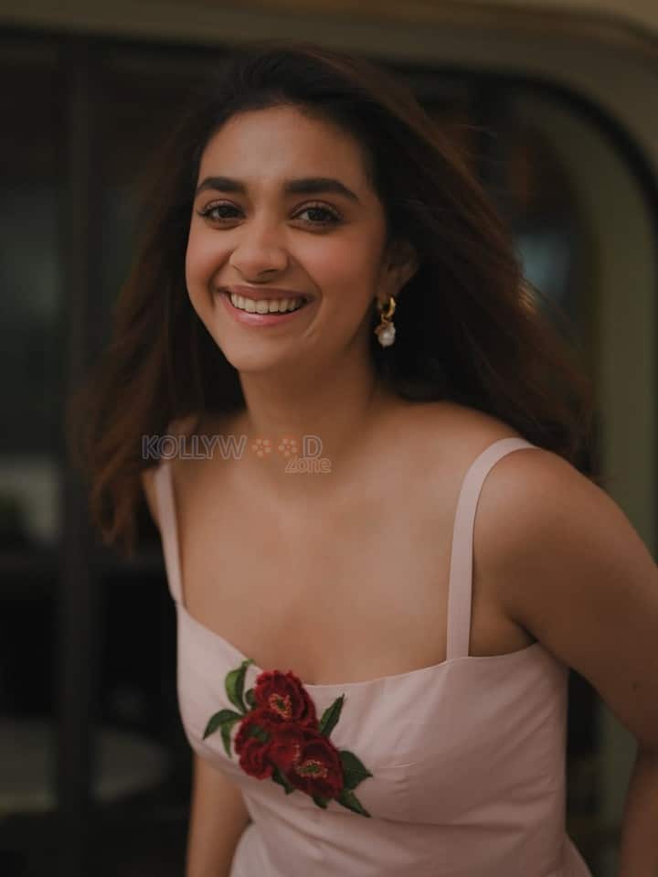 Glamorous Keerthy Suresh in a Light Pink Strappy Gown with a Red Rose Photos 05