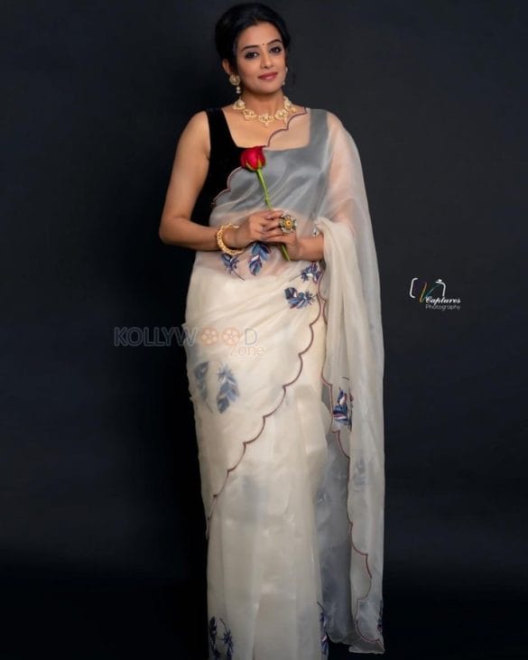 Glamorous Priyamani In A White Transparent Saree With Black Sleeveless ...