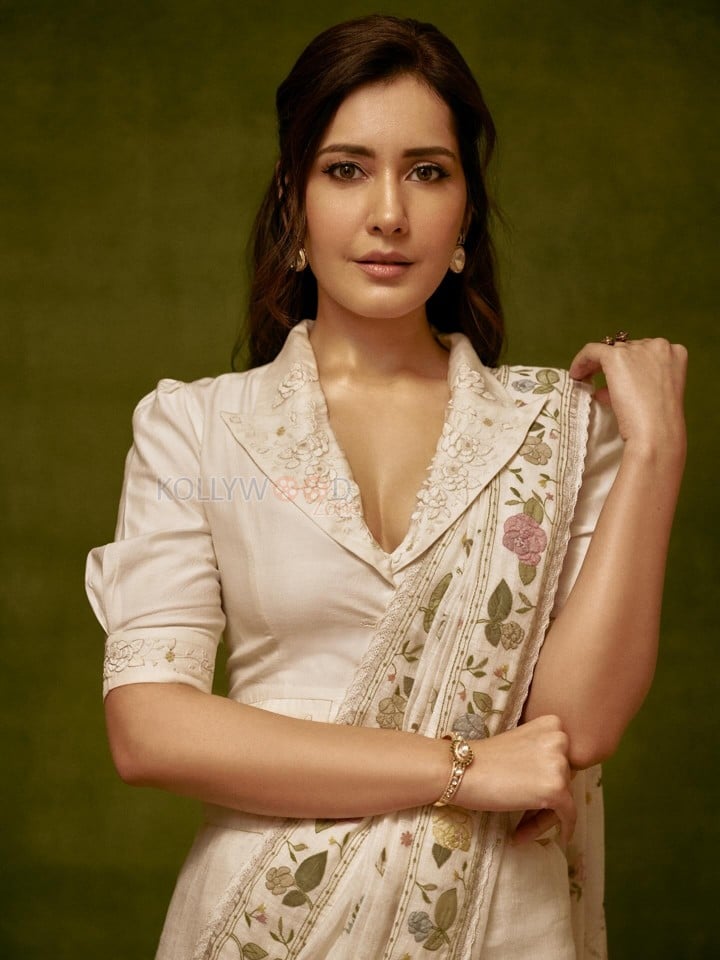 Graceful Raashi Khanna in an Ivory Linen Saree with Floral Embroidery with Puff Sleeve Blouse Photos 01