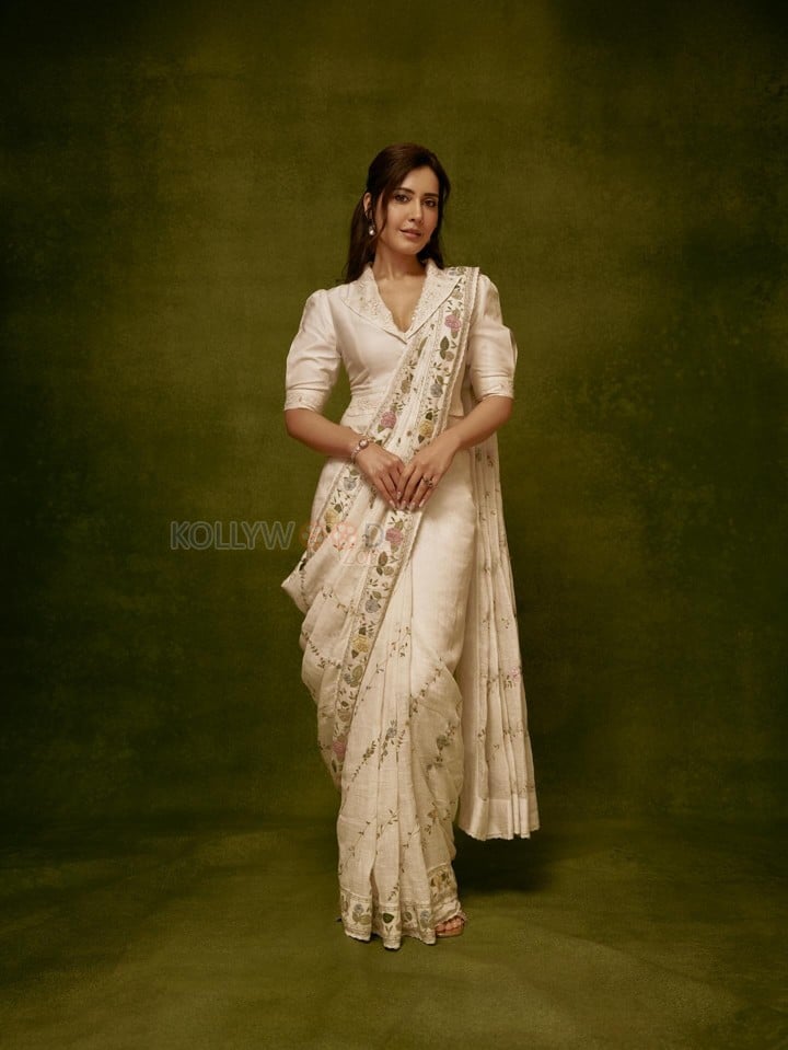Graceful Raashi Khanna in an Ivory Linen Saree with Floral Embroidery with Puff Sleeve Blouse Photos 02