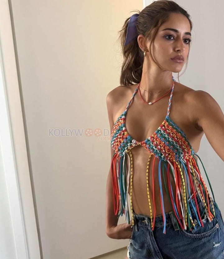 Hot Ananya Panday in a Multi Color Crochet Halter Bikini Top with Fringe Details and Denim Shorts Pictures 02
