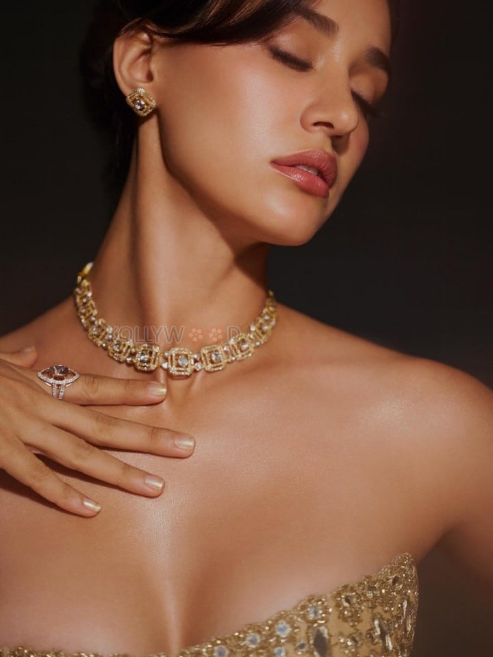 Hot Disha Patani in a Soft Gold Strapless Bodycon Gown Photos 01