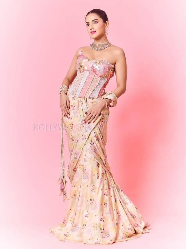 Hot Malvika Sharma in a Pastel Pink Sequined Embroidered Corset Top with Floral Embellishments and Pre Draped Saree Pictures 02