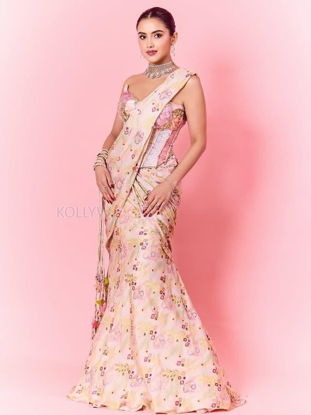 Hot Malvika Sharma in a Pastel Pink Sequined Embroidered Corset Top with Floral Embellishments and Pre Draped Saree Pictures 03